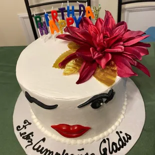 a birthday cake with a flower on top