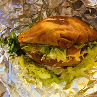 a sandwich wrapped in foil
