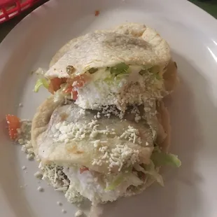 a sandwich on a plate with chips