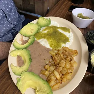 2 egg breakfast with tomatillo salsa and a side of avocado