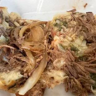 Inside the Birria Mulitas. (Grilled onions added by me)