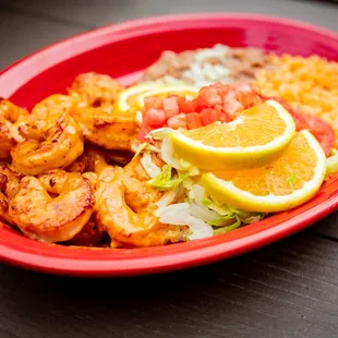a plate of shrimp and rice