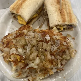 Farm steak samwich with hashbrowns well done with onions
