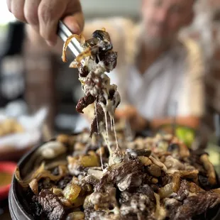 Steak fajitas with mushrooms and cheese