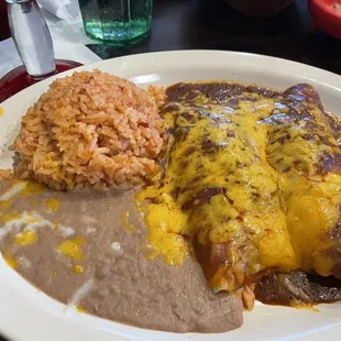 My order, chicken enchiladas with red sauce, rice and frijoles.