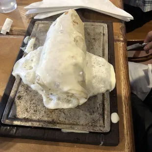 a burrito covered in cheese