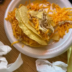 shredded cheese and shredded chicken tacos