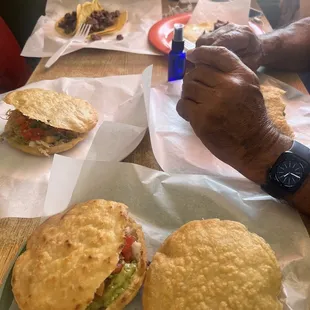 a man eating a taco sandwich