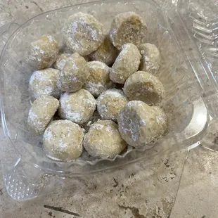 The wedding cookies are bite size. They are so soft, they fall apart in your mouth with tiny little pieces of almonds.