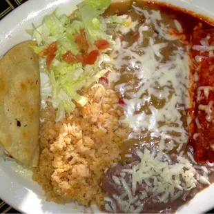 Chicken taco, chile relleno, enchilada plate with rice and beans