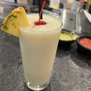 a drink with a pineapple garnish