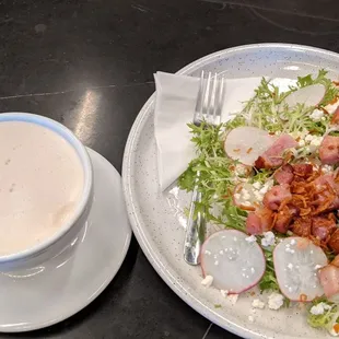 Chai tea latte and frisee aux lardons salad