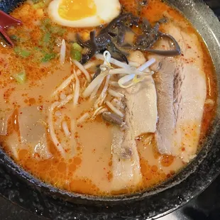 a bowl of ramen and a boiled egg