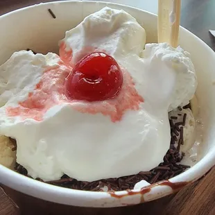 an ice cream sundae with a cherry on top