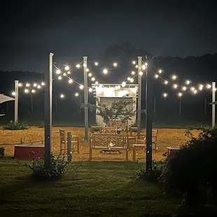 a patio with string lights