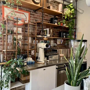 a kitchen with a brick wall