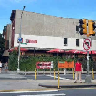 a woman standing in front of a building