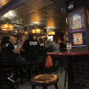 people sitting at a bar