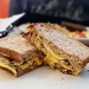 Sausage shipwreck with cheese on wheat toast, $4