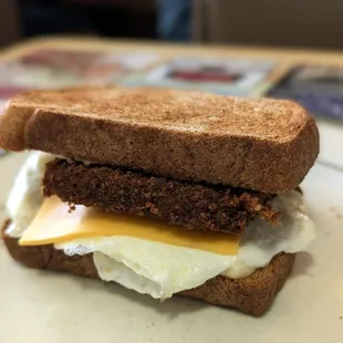 Livermush, egg, and cheese on toasted wheat.