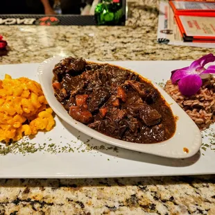 Jamaican stew beef with mac and cheese/rice and peas. Very good!