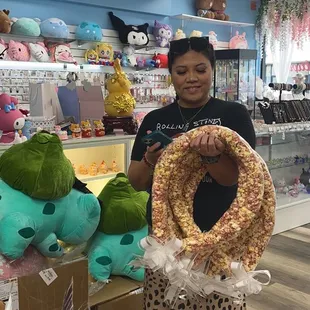 Our very beautiful, photogenic business supporter with 5 popcorn leis! For Castle HS graduation-- maroon and gold :-)