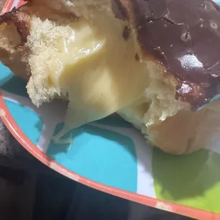Inside of my Great  custard filled chocolate iced donut this morning!