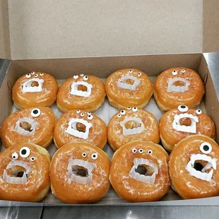 a box of doughnuts with eyes
