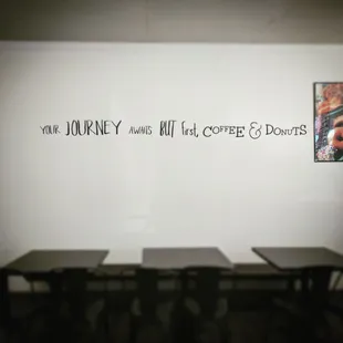 a wall with a quote on it