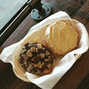 a chocolate donut and a peanut butter donut