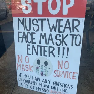 a stop sign in front of a store