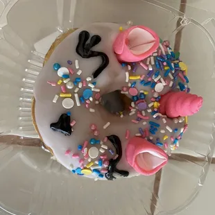 a frosted donut with sprinkles