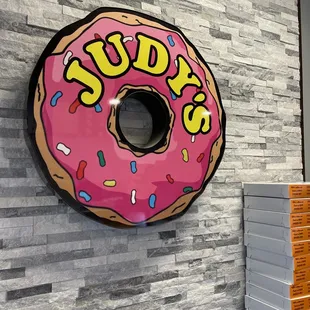 a pink donut with sprinkles