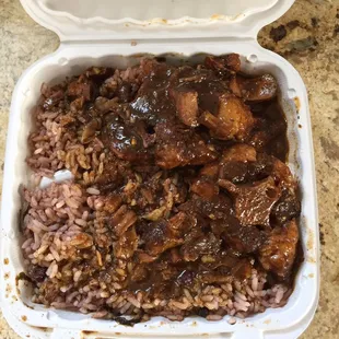 Ox tail w/ rice and peas with extra gravy. No veggies for me on this dish.