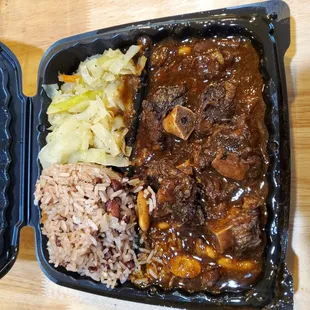 Oxtail, red beans and rice with cabbage.