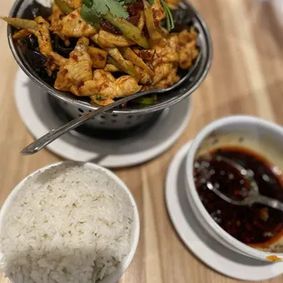 a bowl of rice and a bowl of chicken