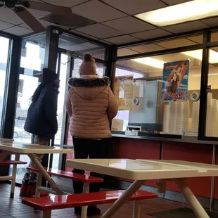 a woman standing at the counter