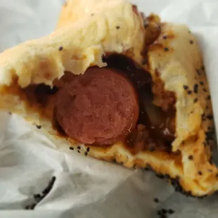 Inside the chili and onion dog.