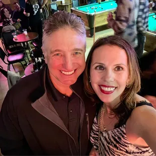 a man and woman posing for a picture