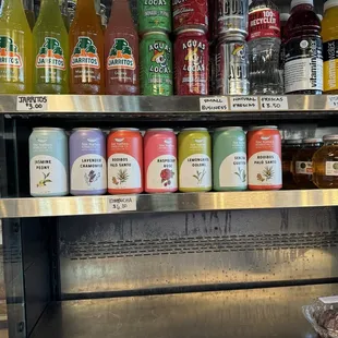 A HUGE selection of local Fine Feathers Kombucha in their grab and go cooler! They taste as good as they look:D