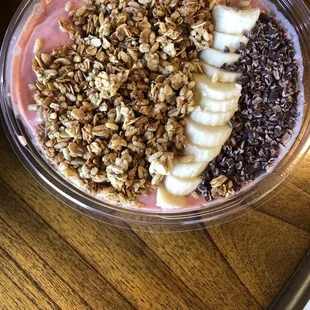 PB&amp;J smoothie bowl with added granola, sliced banana, and cacao nibs.