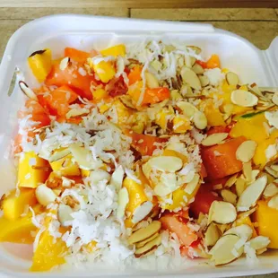 a container of fruit and rice