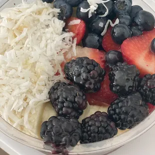 a bowl of fruit and coconut