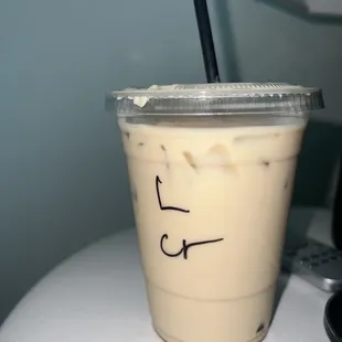 a cup of iced coffee on a table