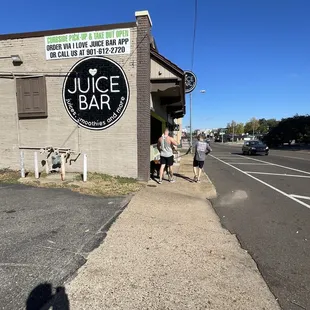 a woman walking down the sidewalk