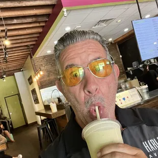 Me having a smoothie with added protein and probiotic.