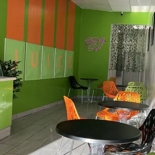 orange and green chairs and tables