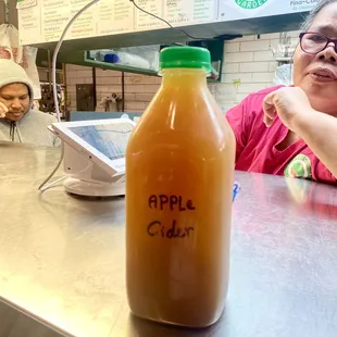 Saturday, 9 December 2023 -- $8 APPLE CIDER (cold) from the Juice Garden inside the West Side Market.