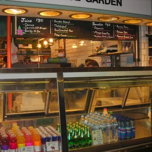 a display case with a variety of drinks