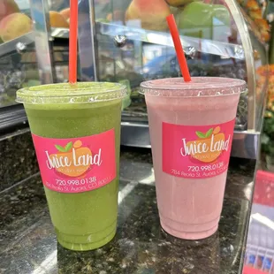two smoothie drinks on a counter